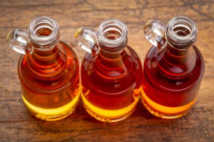 Three bottles of maple syrup.