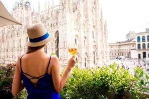 A woman enjoying a spritz aperol in Milan.