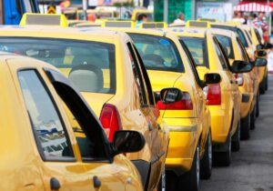 Yellow cabs stuck in traffic.