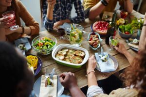 A group of people enjoying a sit down meal.