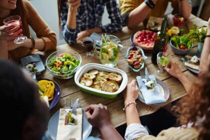 A group of people enjoying a sit down meal.