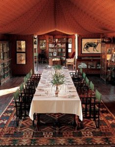 Dining room surrounded by museum pieces and books. Photo courtesy of Jack's Camp.