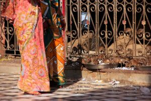 Woman walking to Karni Mata Temple.