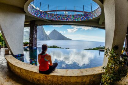 traveler gazing out at the Pitons (volcanic mountains) from Jade Mountain vegan resort in St. Lucia