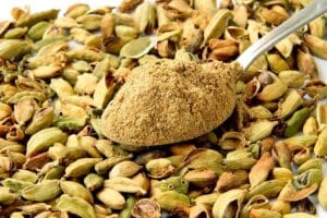 Close up photo of cardamon seeds and powder.