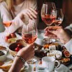 Saying cheers in a French restaurant.