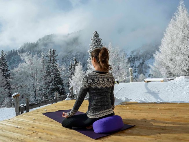 woman having yoga adventures in the Austrian Alps
