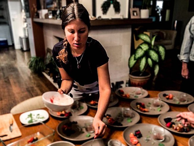 woman cooking healthy plant-based food on a Mallorca yoga retreat