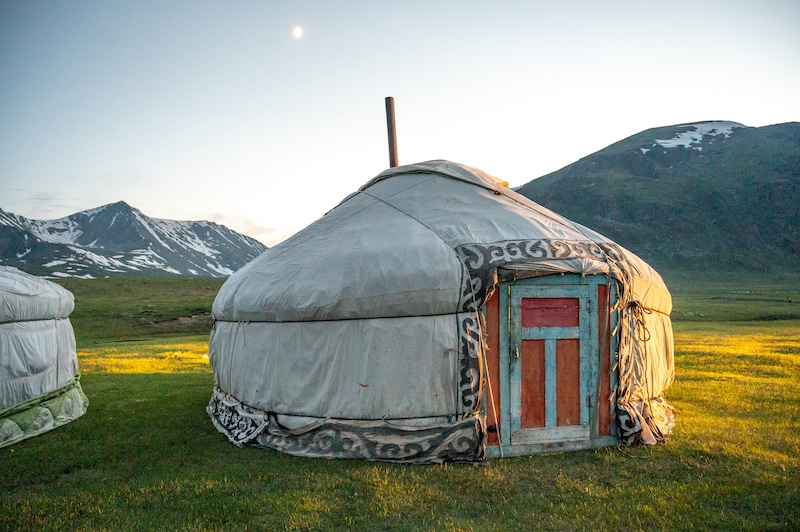 Mongolian ger (yurt) with the Altai Mountains in the background