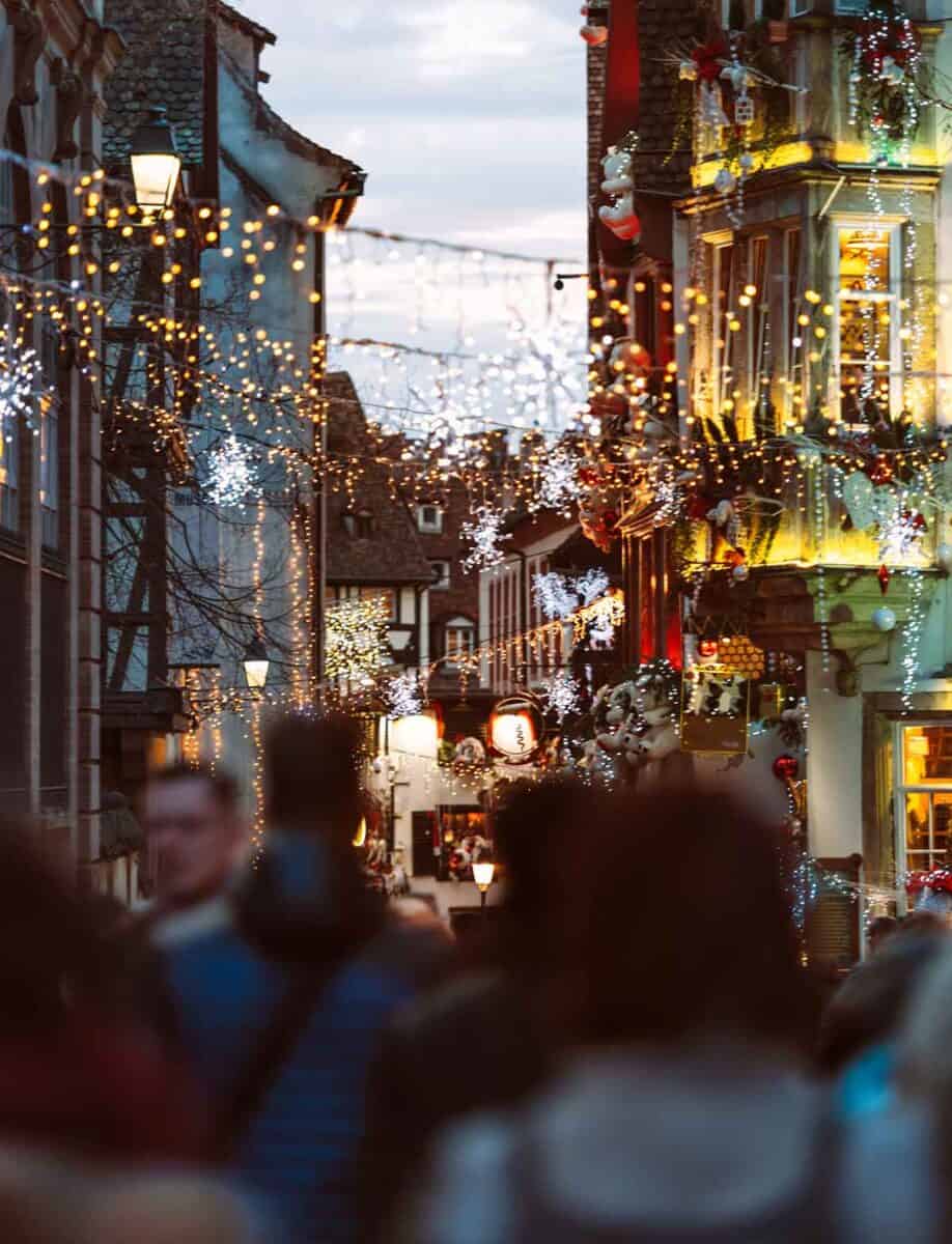 A group of people in Strasbourg Christmas Market.
