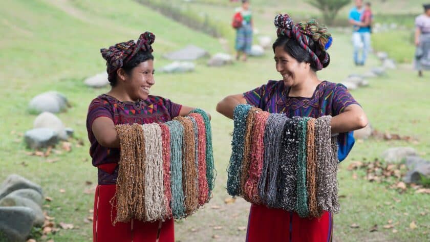 women from the Wakami women’s empowerment artisan group in Guatemala crafting beautiful bracelets