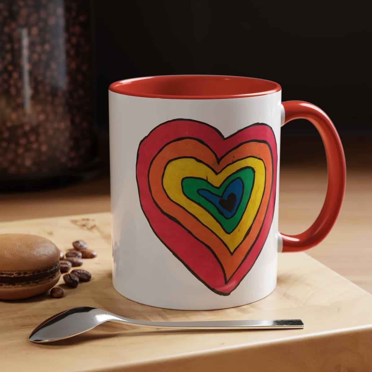 mug featuring a rainbow heart that gives back to charity