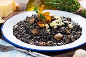 Cuttlefish ink risotto with Parmesan cheese, a staple food in Istria