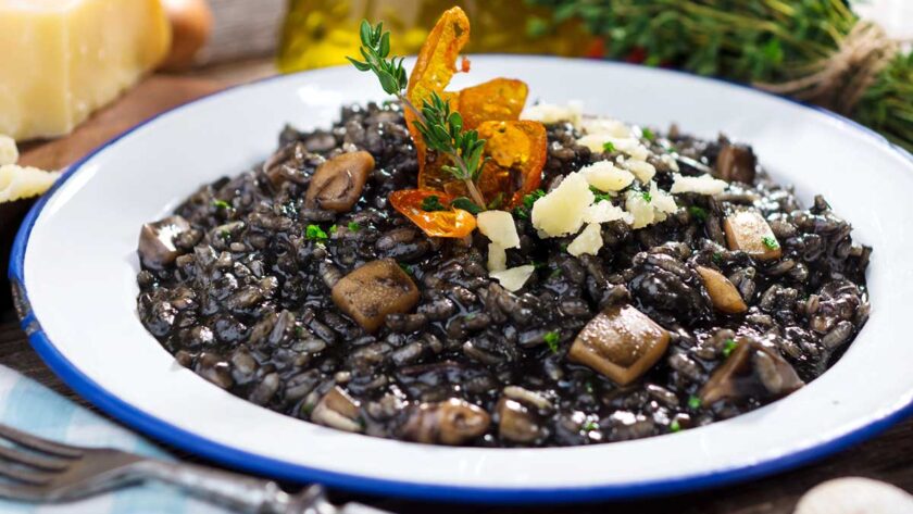 Cuttlefish ink risotto with Parmesan cheese, a staple food in Istria