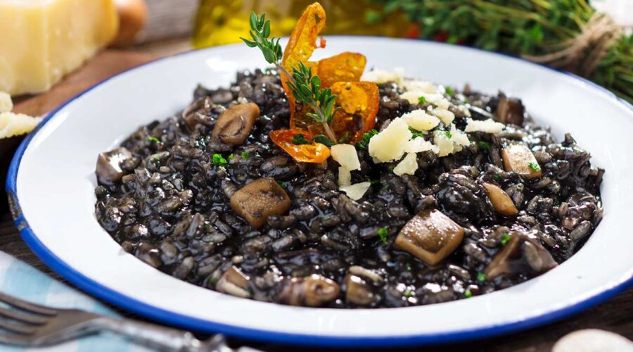 Cuttlefish ink risotto with Parmesan cheese, a staple food in Istria