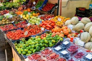 Stall with fresh vegetables and fruits in Mercato del Novale, Bologna.